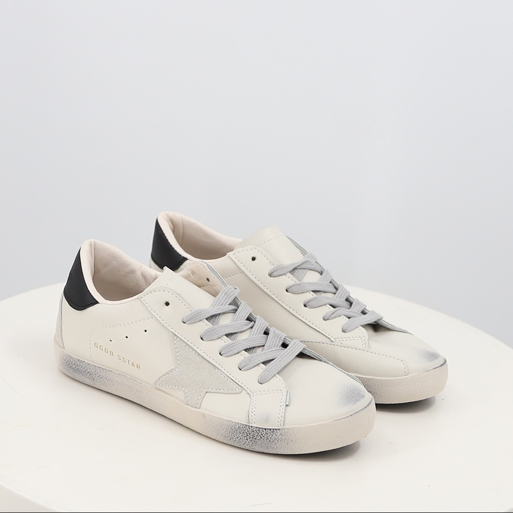 Women’s Distressed Sneaker with grey star detailing in white faux leather